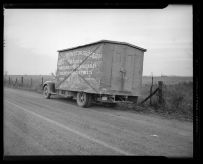 The Travelers Insurance Company; claim department, post-accident                             scene photograph; truck carrying a shipping containing parked along side                             of the road, container labeled 