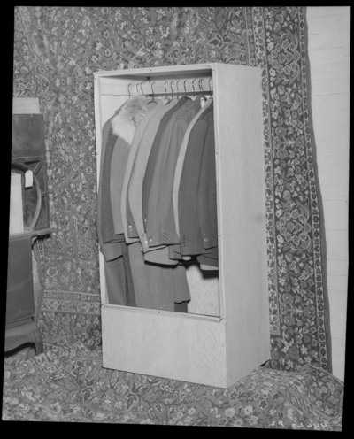 Allender Brown Company, 256-258 West Vine; coats hanging in a                             small closet (cupboard)