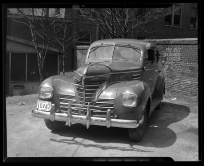 C.A. Amy; car (automobile) parked next to brick wall, Kentucky                             license plate number 10V47 Nelson County (KY License no.                             10V47)