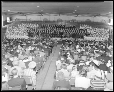 Allstate Choir; choir members and audience fill an                             auditorium