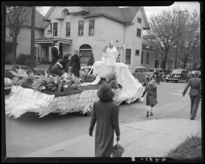 May Day Exercises, (1941 Kentuckian) (University of Kentucky);                             four women riding on the ALPHA GAMMA DELTA float