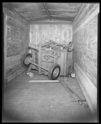Hinkle Construction Company; interior of freight car,                             machinery