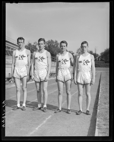 Track Team, (1941 Kentuckian) (University of Kentucky); four                             members standing on the track