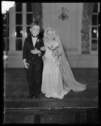 Tom Thumb Wedding; North Middletown; interior of church, small                             boy and girl walking down the aisle