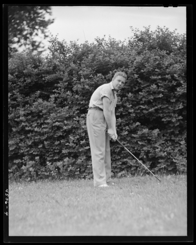 University of Kentucky Varsity Golf Team, (1941 Kentuckian)                             (University of Kentucky); individual member holding a golf club, in                             position to swing club