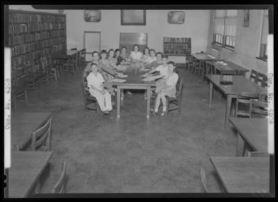 Junior Scholastic League, Bryan Station School; league members                             gathered around a table for group portrait