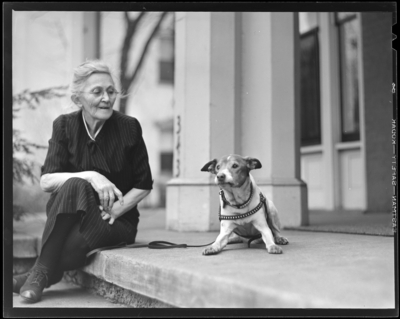 Mrs. March & dog (age 14); woman and dog sitting on                             porch