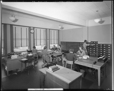 Lexington Credit Bureau; Radio Building, interior office; staff                             working at desk and tables