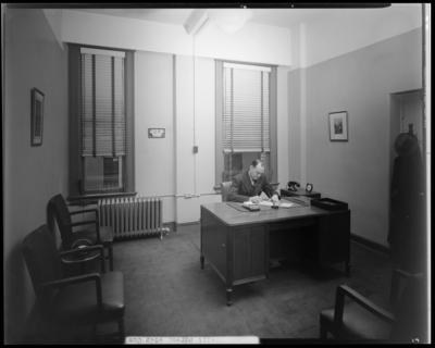 Lexington Credit Bureau; Radio Building, interior of office; man                             working at a desk