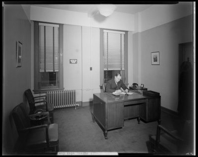 Lexington Credit Bureau; Radio Building, interior of office; man                             working at a desk