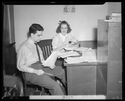 Campus scenes, (1941 Kentuckian) (University of Kentucky);                             secretary sitting next to a man working at a desk