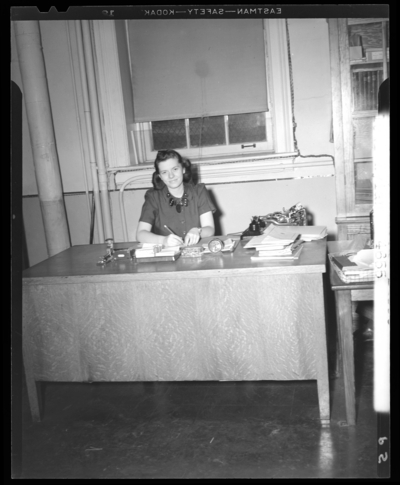 Campus scenes, (1941 Kentuckian) (University of Kentucky);                             secretary sitting at a desk