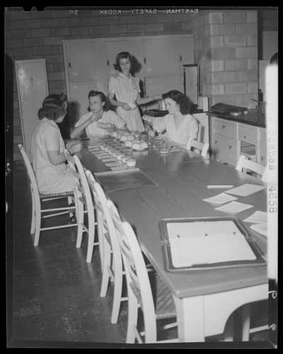 Campus Scenes, (1941 Kentuckian) (University of Kentucky); four                             women working in a Home Economics classroom