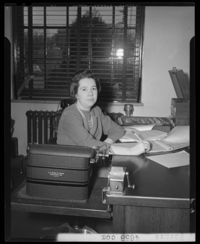 Campus Scenes, (1941 Kentuckian) (University of Kentucky); woman                             sitting at a desk