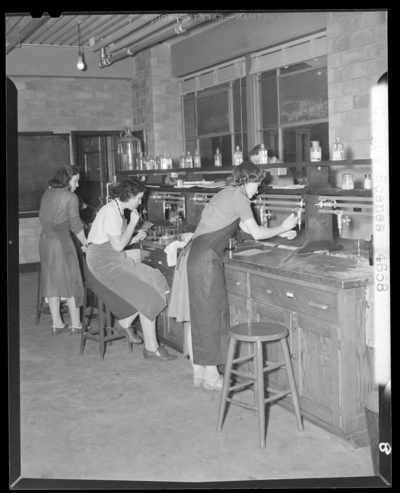 Campus Scenes, (1941 Kentuckian) (University of Kentucky);                             Chemistry Lab (Laboratory) classroom, women working at lab (laboratory)                             tables