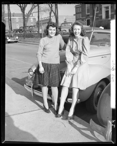 Campus Scenes, (1941 Kentuckian) (University of Kentucky); two                             women leaning on the hood of a car, 1941 Kentucky license plate number                             M8347 (no. M8347) Fayette County