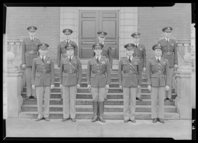 Military Company E, (1941 Kentuckian) (University of Kentucky);                             exterior library steps; group portrait of men in uniform