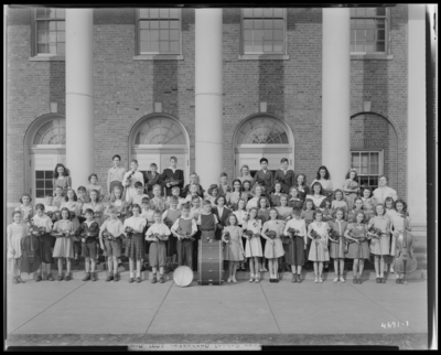 All City Elementary School Orchestra, Henry Clay School;                             exterior, group portrait of children holding their musical                             instruments