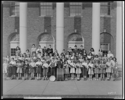 All City Elementary School Orchestra, Henry Clay School;                             exterior, group portrait of children holding their musical                             instruments