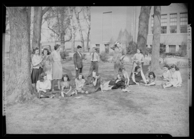 North Middletown High (School); exterior, unidentified club                             (dramatic?), group gathered on the lawn (grass)