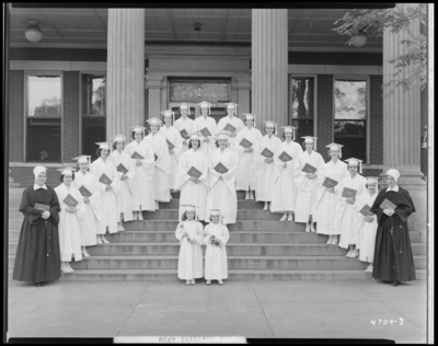 St. Joseph's Hospital, 544 West Second (2nd) Street; Nurses                             graduation; exterior steps of building, group portrait of nurses holding                             diplomas