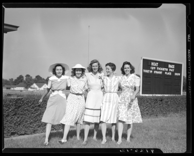 Loom & Needle, 170 Esplanade (clothing); models for                             advertisement, models standing next to a billboard