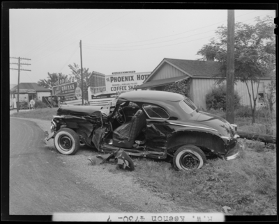 R.W. Keenon, Attorney; accident scene photographs, automobile                             wreck (crash) on Harrodsburg Pike; death (woman, wife); damaged car                             (side view)