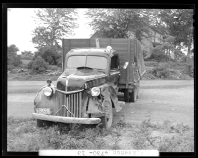R.W. Keenon, Attorney; accident scene photographs, automobile                             wreck (crash) on Harrodsburg Pike; death (woman, wife); damaged truck                             (front view), Indiana license plate number T123270 (no.                             T123270)
