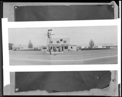 Marshall’s Court Tourist (Georgetown Road); exterior view of                             court and gas pumps (service station), altered negative