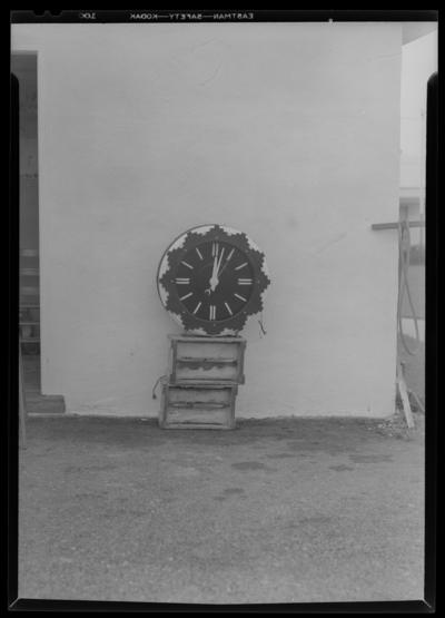 Marshall’s Court Tourist (Georgetown Road); large clock propped                             on boxes