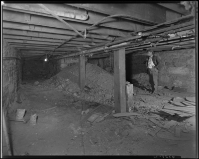 Ben Snyder (department store, 113-117 East Main) building;                             cellar, workers and construction debris