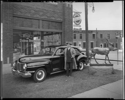 Goodwin Brothers, 444-450 East Main, Dodge Brothers Motor                             Vehicles; exterior of building, man standing next to car