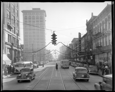 Dupont; Main Street, Christmas scenes (decorations); view looking                             down length of Main Street; police officer standing in the middle of the                             road