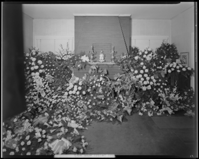 Henry Gentry; corpse, open casket surrounded by                             flowers