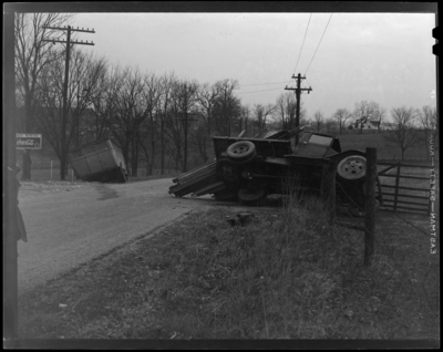 State Auto Mutual Insurance Company: wreck of Fayette                             African-American segregated school bus and truck; view of roadway,                             overturned truck (spilt lumber) and school bus in ditch