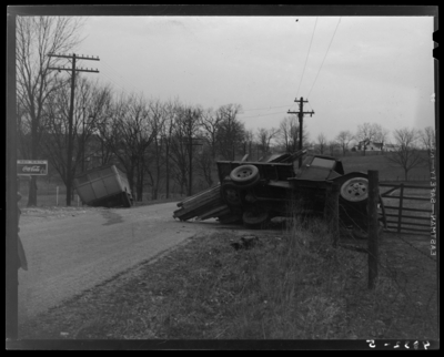 State Auto Mutual Insurance Company: wreck of Fayette                             African-American segregated school bus and truck; view of roadway,                             overturned truck (spilt lumber) and school bus in ditch