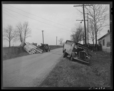 State Auto Mutual Insurance Company: wreck of Fayette                             African-American segregated school bus and truck; tow truck hoisting                             truck into upright position