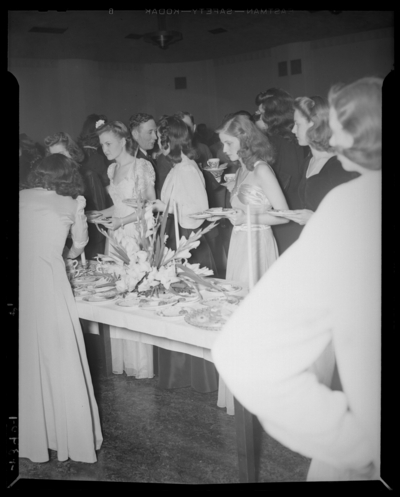 Legislators Reception, (1942 Kentuckian) (University of                             Kentucky); people gathered around the buffet table