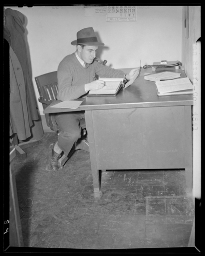 Kentuckian Staff & Press Room, (1942 Kentuckian)                             (University of Kentucky); McVey Hall, basement; man working at a                             desk