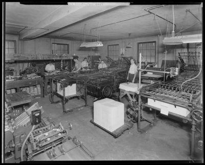 Kentuckian Staff & Press Room, (1942 Kentuckian)                             (University of Kentucky); McVey Hall, basement; workers operating press                             equipment