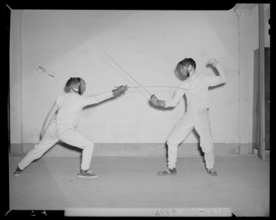 Fencing team, (1942 Kentuckian) (University of Kentucky); two                             fencers engaged