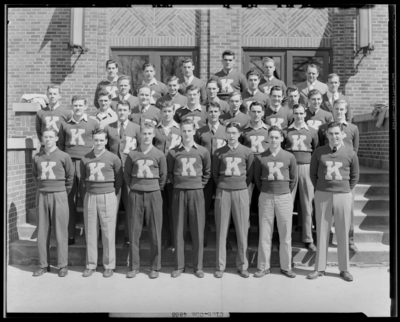 K. Club, (1942 Kentuckian) (University of Kentucky); exterior,                             group portrait of members wearing sweaters with a monogrammed                             
