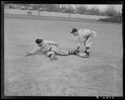 Baseball players, (1942 Kentuckian) (University of Kentucky); two                             players on the baseball field