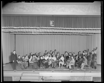 Orchestra, Lafayette High School; interior, orchestra members on                             stage; photographs requested by Dr. Crawford (Principal)