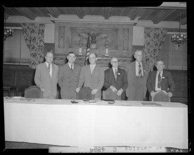 Elmer Jenkins (National Automotive Association Traveling                             Manager); Fireside Room, Phoenix Hotel; interior, group of men standing                             next to a conference table; group portrait