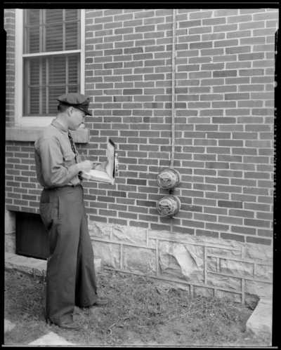 Kentucky Utilities Company; building, exterior; man reading                             electric meter (meter reader)