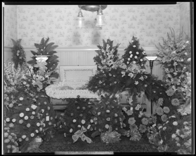 Mrs. Lucy Smith; corpse, open casket surrounded by flowers;                             photograph taken at home of Mrs. Soper (361 Transylvania)
