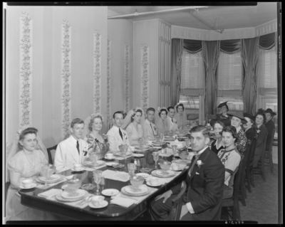 Mr. & Mrs. Jay Richard Miller Jr.; wedding party seated                             at banquet table