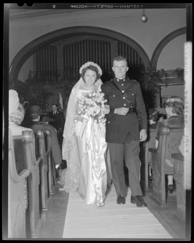 Robinson Wedding (two weddings); West Maple, Nicholasville);                             portrait book; bride and groom walking down the isle; groom dressed in a                             uniform
