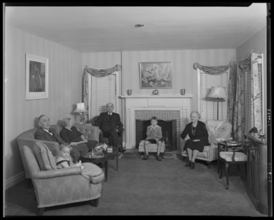 Frank J. Reeves & Family; interior, living room; family                             members sitting